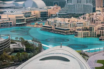 a view of a city with a river and buildings at Vogue Downtown Forte near Dubai Mall and Burj Khalifa, Two-Bedroom Apartment with Balcony and City View, full access to all amenities in Dubai