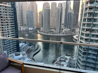 a view of a river in a city with tall buildings at Marina Bliss-Live where Luxury Meets the Sea in Dubai