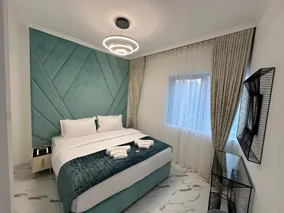 a bedroom with a large bed and a window at Marina Bliss-Live where Luxury Meets the Sea in Dubai