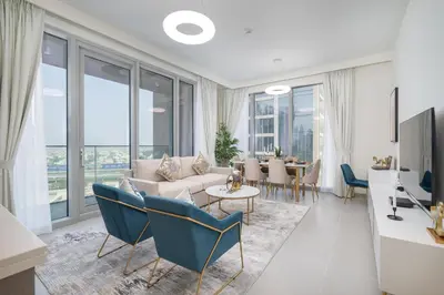 a living room with a couch and a table at Vogue Downtown Forte near Dubai Mall and Burj Khalifa, Two-Bedroom Apartment with Balcony and City View, full access to all amenities in Dubai