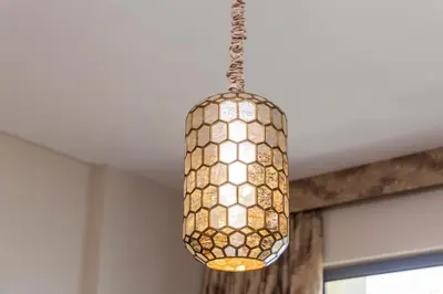a pendant light hanging from a ceiling at NEU Sea and Burj View Port de La Mer in Dubai