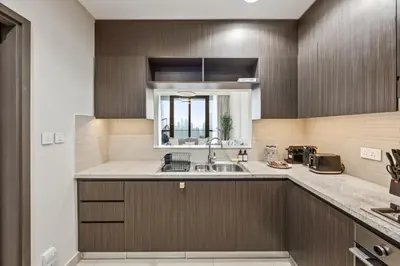 a kitchen with a sink and a counter top at 2BR Apt Direct Dubai Mall Access Burj View in Dubai
