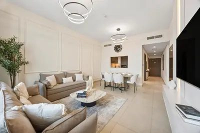 a living room with a couch and a table at 2BR Apt Direct Dubai Mall Access Burj View in Dubai