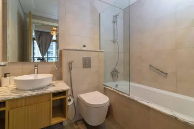 a bathroom with a sink and a toilet and a shower at Samani vacation homes 2217 in Dubai