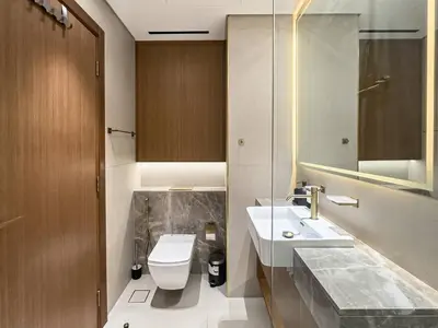 a bathroom with a sink and a toilet at Modern Studio with Private Jacuzzi in Dubai