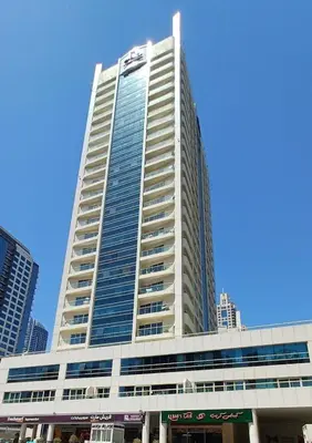 a tall building with a lot of windows on it at Marine View Tower aparthotel in Dubai