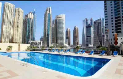 a large swimming pool on the roof of a building at Marine View Tower aparthotel in Dubai