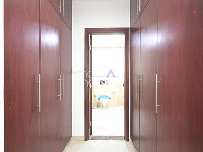 a hallway with two wooden doors and a mirror at Spacious 3BR in Zen Tower Dubai Marina in Dubai