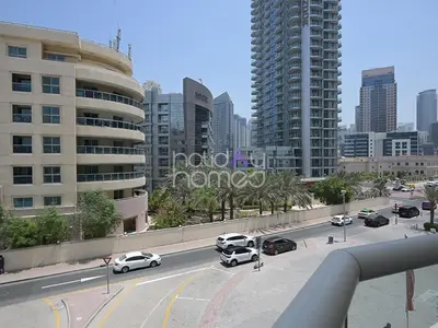 a city street with cars parked on the road at Spacious 3BR in Zen Tower Dubai Marina in Dubai