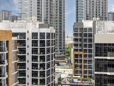 a view of tall buildings in a city at Livin' Holidays - Studio - Azizi Near Downtown in Dubai