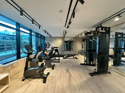 a gym with treadmills and cardio equipment in a building at Stylish One Bedroom Apartment at Binghatti Crest, JVC Dubai By al sarya Holiday Homes in Dubai