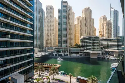 a view of a river in a city with buildings at StayShort - Dubai Marina sleeps 4 with Water Views! in Dubai