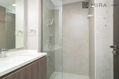 a bathroom with a shower and a sink at Mira Holiday Homes - Paragon by IGO Studio Where Style Meets Comfort in Dubai