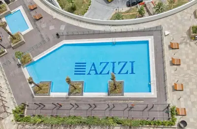 an overhead view of a swimming pool with an akira logo at Elegant Apartment with Burj Khalifa View in Dubai