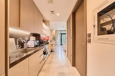 a kitchen with a sink and a counter at FAM Living Dubai Escape Sleek Studio at Peninsula Five in Dubai
