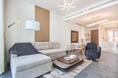a living room with a couch and a table at STAY BY LATINEM Luxury 2BR Plus Study Holiday Home CB 3312 Near Burj Khalifa in Dubai