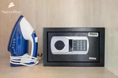 a tv with a remote control and a game controller at MarvelStay-Infinity Pool-Beachfront-The Palm in Dubai