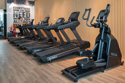 a row of tread machines in a gym at MarvelStay-Infinity Pool-Beachfront-The Palm in Dubai