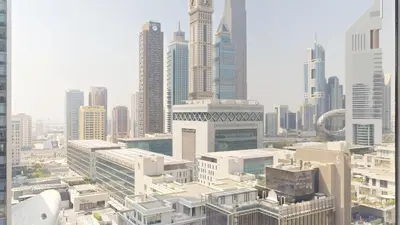 an aerial view of a city with tall buildings at Sky Gardens - High Rise Studio with Cityscape View in Dubai