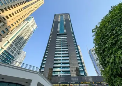 a tall building in the middle of two other buildings at Cosmos Living Majestic Studio GCV2 in Dubai