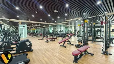 a gym with a lot of treadmills and machines at Vogue Al Furjan Pearlz by Danube near Ibn Battuta Mall, Three Bedroom plus Kids room Apartment with Balcony and Private pool, Access to all Amenities, Walkable to Al Furjan Metro Station in Dubai