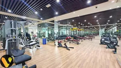 a gym with a lot of treadmills and machines at Vogue Al Furjan Pearlz by Danube near Ibn Battuta Mall, Three Bedroom plus Kids room Apartment with Balcony and Private pool, Access to all Amenities, Walkable to Al Furjan Metro Station in Dubai