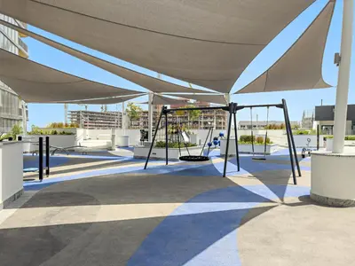 a swing set under a canopy on a roof at Luxury 2BR in Sobha Hartland in Dubai