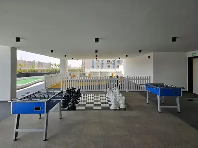 a room with ping pong tables in the middle at Vogue Al Furjan Pearlz by Danube near Ibn Battuta Mall, One Bedroom Apartment with Balcony and Pool View, Access to all Amenities, Walkable to Al Furjan Metro Station in Dubai