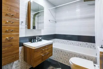 a bathroom with a sink and a tub and a toilet at Modern and Spacious 2BR in Glamz, Al Furjan in Dubai