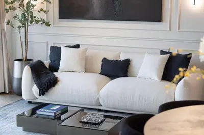 a white couch in a living room with a table at Premium Suite 3 BR 200 degree Views 85-inch TV and Sunset View in Dubai