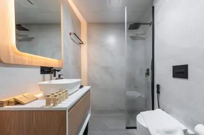 a bathroom with a sink and a shower at TRPS - Alef Noon, JVC - Brand New - Luxury Furnished 1BR - Prime JVC Location in Dubai