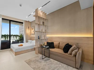 a living room with a couch and a bed at BLVD - Stylish Stay with Private Jacuzzi and Canal View in Dubai