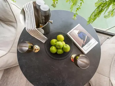 a table with a bowl of grapes and a cup of coffee at BLVD - Stylish Stay with Private Jacuzzi and Canal View in Dubai