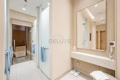 a bathroom with a shower and a sink and a mirror at Luxury 1BR Stay, Connected to Dubai Mall and Burj Khalifa, Vida Dubai Mall Tower 2, Downtown Dubai by Deluxe Holiday Homes in Dubai