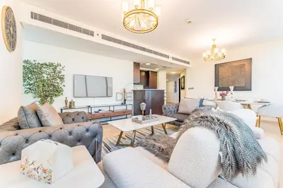 a living room with couches and a table at Close to Museum of the Future with Zaabeel Palace Views, Minutes from Dubai Mall And Burj Khalifa - Sky Gardens, DIFC by Deluxe Holiday Homes in Dubai