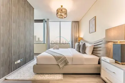 a bedroom with a large bed and a large window at Close to Museum of the Future with Zaabeel Palace Views, Minutes from Dubai Mall And Burj Khalifa - Sky Gardens, DIFC by Deluxe Holiday Homes in Dubai