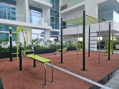 a playground with yellow equipment in a building at Vogue Al Furjan Pearlz by Danube near Ibn Battuta Mall, One Bedroom Apartment with Terrace and vibrant community view, Access to all Amenities, Walkable to Al Furjan Metro Station in Dubai