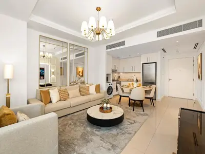 a living room with a couch and a table at Kensington Perfect 1BR Burj View and Dubai Mall Link in Dubai