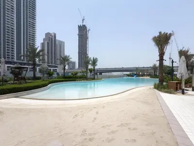 a swimming pool in the middle of the city at GuestReady - 1Bed l Lagoon Escape l Creek Beach in Dubai