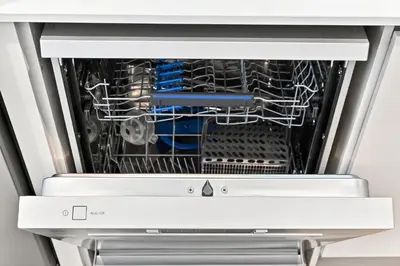 a dishwasher with its door open with a dish rack at Modern 3BD with Maid's Room near Lagoon at Lotus 4 in Dubai