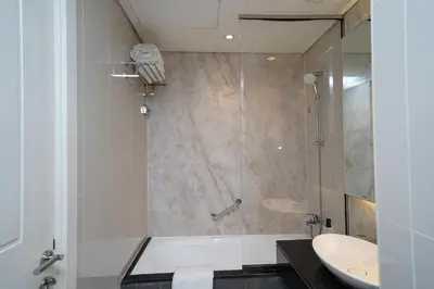 a bathroom with a shower and a sink at Studio with Burj Khalifa view in Dubai