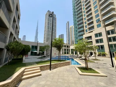 a pool in the middle of a city with tall buildings at Lux Retreat with Iconic Burj Khalifa Views in Dubai