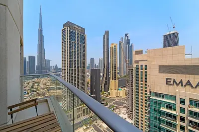 a view of the city from the balcony of a building at Lux Retreat with Iconic Burj Khalifa Views in Dubai