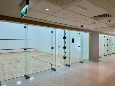 a row of glass doors in a room at Lux Retreat with Iconic Burj Khalifa Views in Dubai
