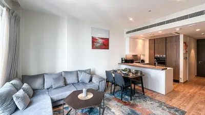a living room with a couch and a table at Exclusive 1BR in Marina Gate Dubai Marina - 46AB03 in Dubai