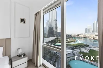 a hotel room with a view of a city at Grande Residence Burj View 2 BR by Evoke Luxury in Dubai
