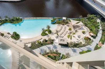 an overhead view of a pool at a resort at GuestReady - 2Bed l Lagoon Escape l Creek Beach in Dubai