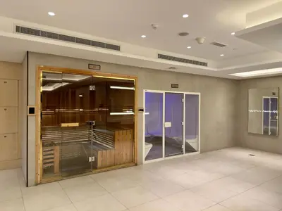 a large room with glass doors in a building at Modern Studio at Elite Downtown Residence in Dubai