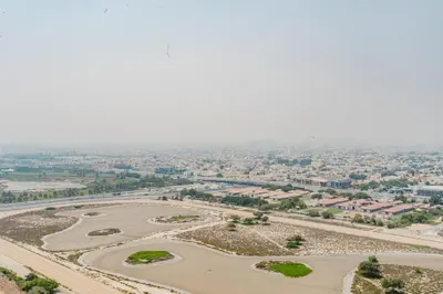 an aerial view of a city with a river at RH-Luxury 1BR Apt in Al Habtoor City with beautiful Canal View in Dubai