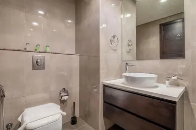 a bathroom with a white sink and a toilet at DAYF-MER Stylish 1Bed in central location Business Bay in Dubai